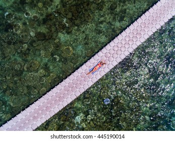 Woman On Pontoon Bridge