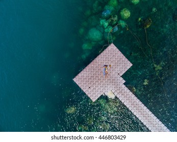 Woman On Pontoon Bridge Aerial View