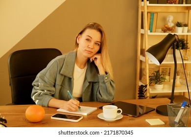 Woman On Remote Work Or Online Education, Using Tablet Computer, Papers And Notes, Indoors At Office Or Home At Daytime. Remote Teaching On Learning Courses For New Profession Or Getting New Skills