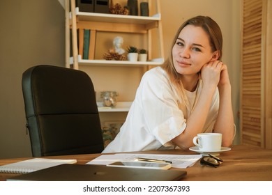 Woman On Remote Work Or Online Education, Using Tablet Computer, Papers And Notes, Indoors At Office Or Home At Daytime. Remote Teaching On Learning Courses For New Profession Or Getting New Skills