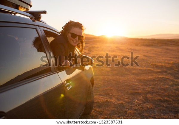 Woman on the road trip, sunset in Cabo\
de Gata-Nijar Natural Park, Andalusia,\
Spain