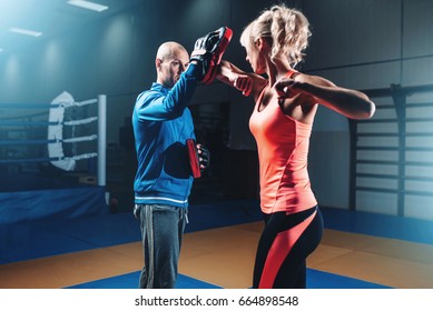 Woman On Self Defense Training With Male Trainer