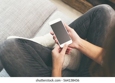 Woman on smartphone - Shutterstock ID 564138436