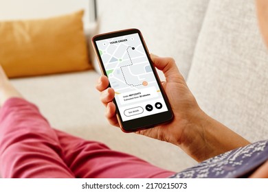 Woman on the sofa checking an online order status with delivery tracking app on smartphone.  - Shutterstock ID 2170215073
