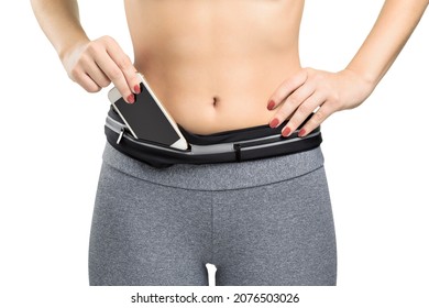 Woman On Sports Clothes Putting A Cellphone On A Waist Pack, Isolated