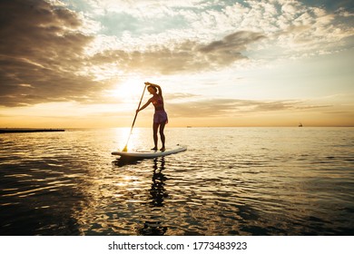Woman On A Stand-Up Paddle