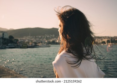 Woman On The Street At Sunset. Authentic And Candid Woman Travel On Road Trip In European Village