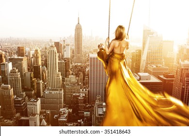 Woman On A Swing Above New York City