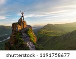 Woman on top mountain in Altai, sunset light, beauty summer landcape