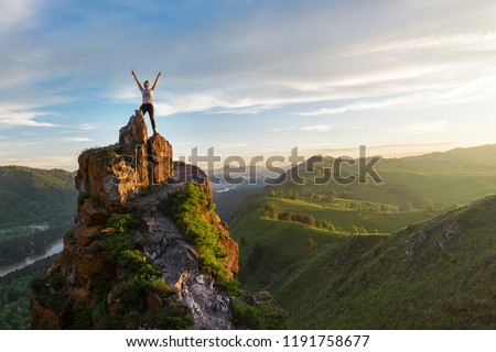 Woman on top mountain in Altai, sunset light, beauty summer landcape