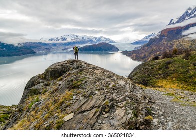 Woman On Top Of The Rock On The Torres Del Paine Trek