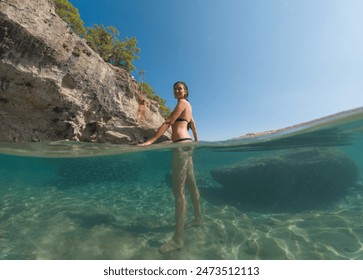 Woman on tropical vacation paradise on sea. Summer sea joy in Turkish seacoast, beaches along Lycian Way, Turkish Riviera. Asian female underwater and turquoise ocean around. - Powered by Shutterstock