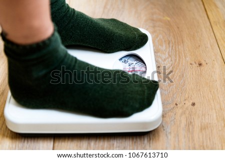 Woman on weight scale