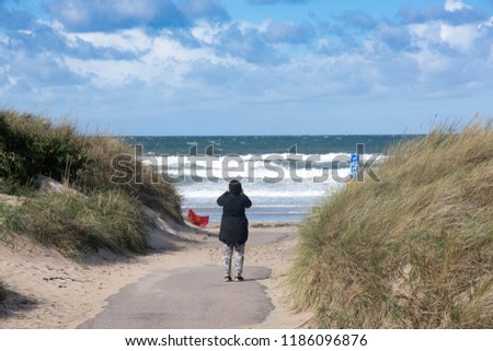 Woman on windy beach
