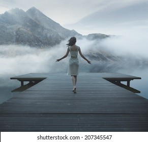 Woman on a wooden bridge - Powered by Shutterstock