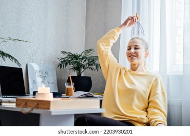 Woman on workplace with Head Massager Scalp Scratcher with Fingers. Self-massage with Head Scratcher Tingler Scalp for reduce Stress and for Hair Growth and Body Deep Relaxation - Powered by Shutterstock