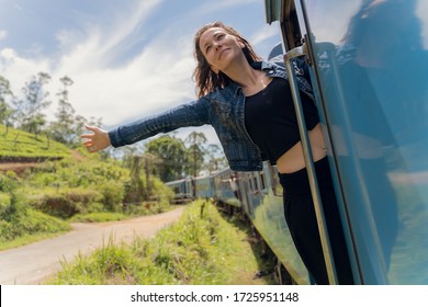 Woman Onboard A Train Passing The Jungle Of Sri Lankan