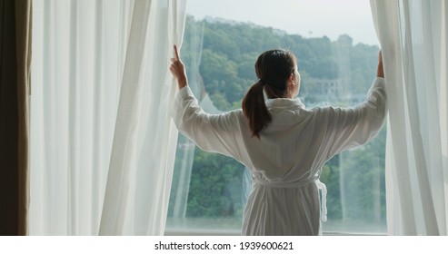 Woman Open The Curtain At Morning