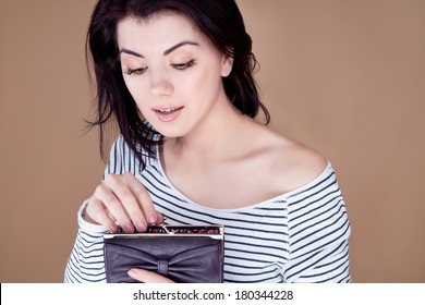 Woman With Open Mouth Look Inside The Purse