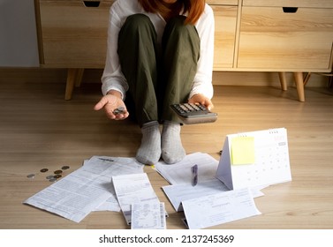 woman open the palm of the hand show some coins and stressed with monthly many bill expenses and some bill past due, debt concept - Shutterstock ID 2137245369