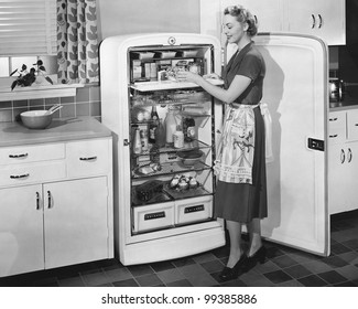 Woman with open refrigerator