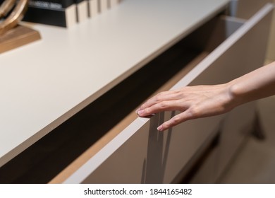 Woman Open Shelf, Pull Open Drawer Wooden In Cabinet.