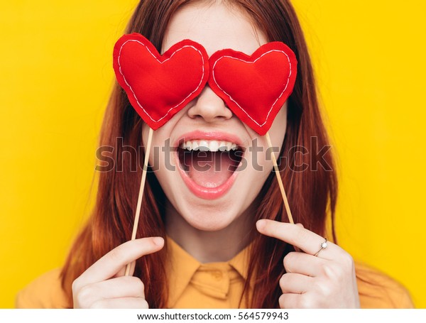The woman opened her mouth in delight, eyes
hearts, bright background
