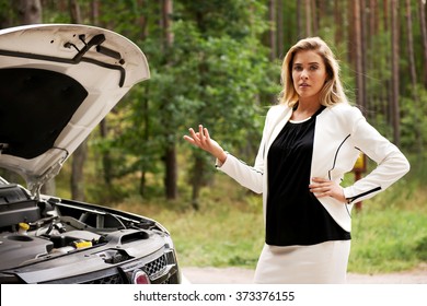 Woman opened the hood broken car