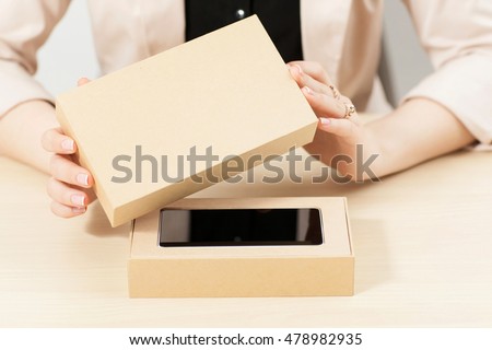 Similar – Image, Stock Photo Unrecognizable woman packing carton box with tape dispenser