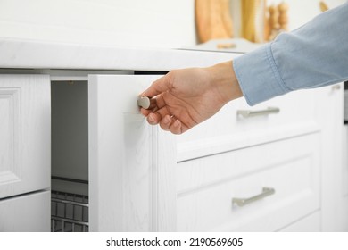 Woman Opening Drawer In Kitchen, Closeup View