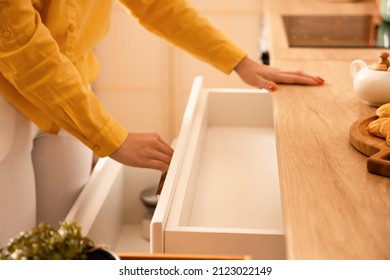 Woman Opening Empty Kitchen Drawer, Closeup