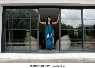 Woman Opening Front Door