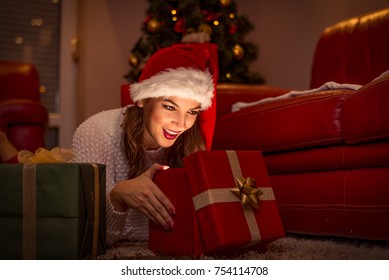 Woman Opening Gift Box. Christmas Time