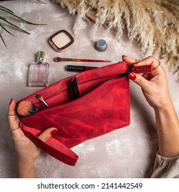 Woman Opening A Handmade Leather Makeup Bag On Her Hands