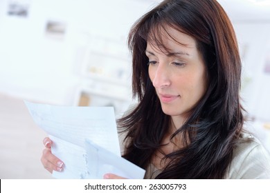 Woman Opening A Letter