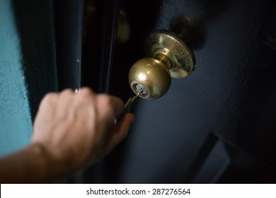 Woman Opening A Locked Door