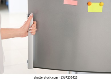 Woman Opening Modern Fridge