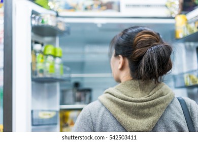 Woman Opening Refrigerator