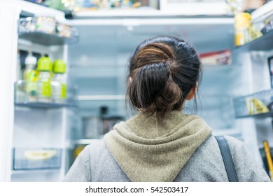 Woman Opening Refrigerator