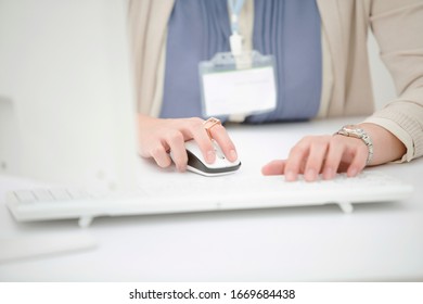Woman operating a personal computer