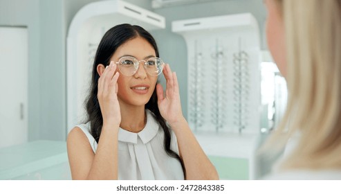 Woman, optometrist and consultation with glasses in store with choice, help and eye care for vision. People, optician and customer with smile for health, wellness or decision for trendy style in shop - Powered by Shutterstock