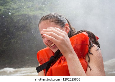 Woman In An Orange Life Jacket