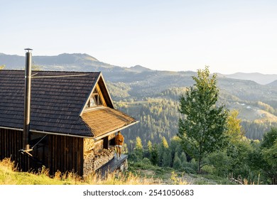 Woman in an orange sweater standing on a wooden porch of a mountain cabin, enjoying the panoramic views of forested hills and distant mountains during golden hour - Powered by Shutterstock