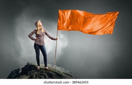 Woman With Orange Waving Flag