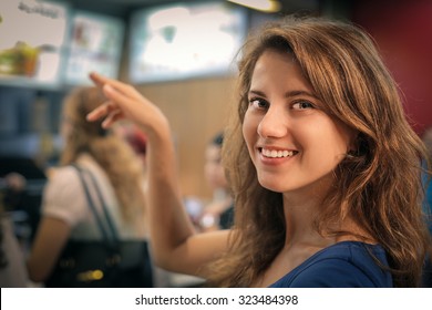 Woman Ordering At A Fast Food Restaurant