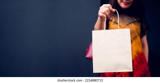 Woman Ordering Her Grocery Online, She Is Holding Shopping Bag Banner Background.supermarket Grocery Delivery Online Food And Grocery In Store.Mock Up Shopping Bag, Business Marketing.banner Website.