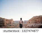 Woman overlooking canyon in Moab, Utah