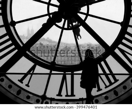 Woman Overlooking Paris France through D'Orsay Museum Clock