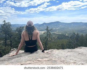 Woman overlooking scenic view on a mountain - Powered by Shutterstock