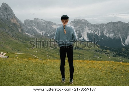 Similar – young man with hat in front of mountain panorama